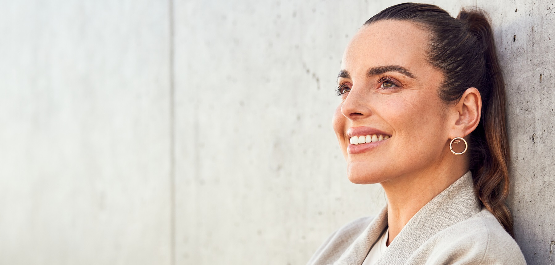 smiling-midlife-woman A smiling midlife woman with a ponytail